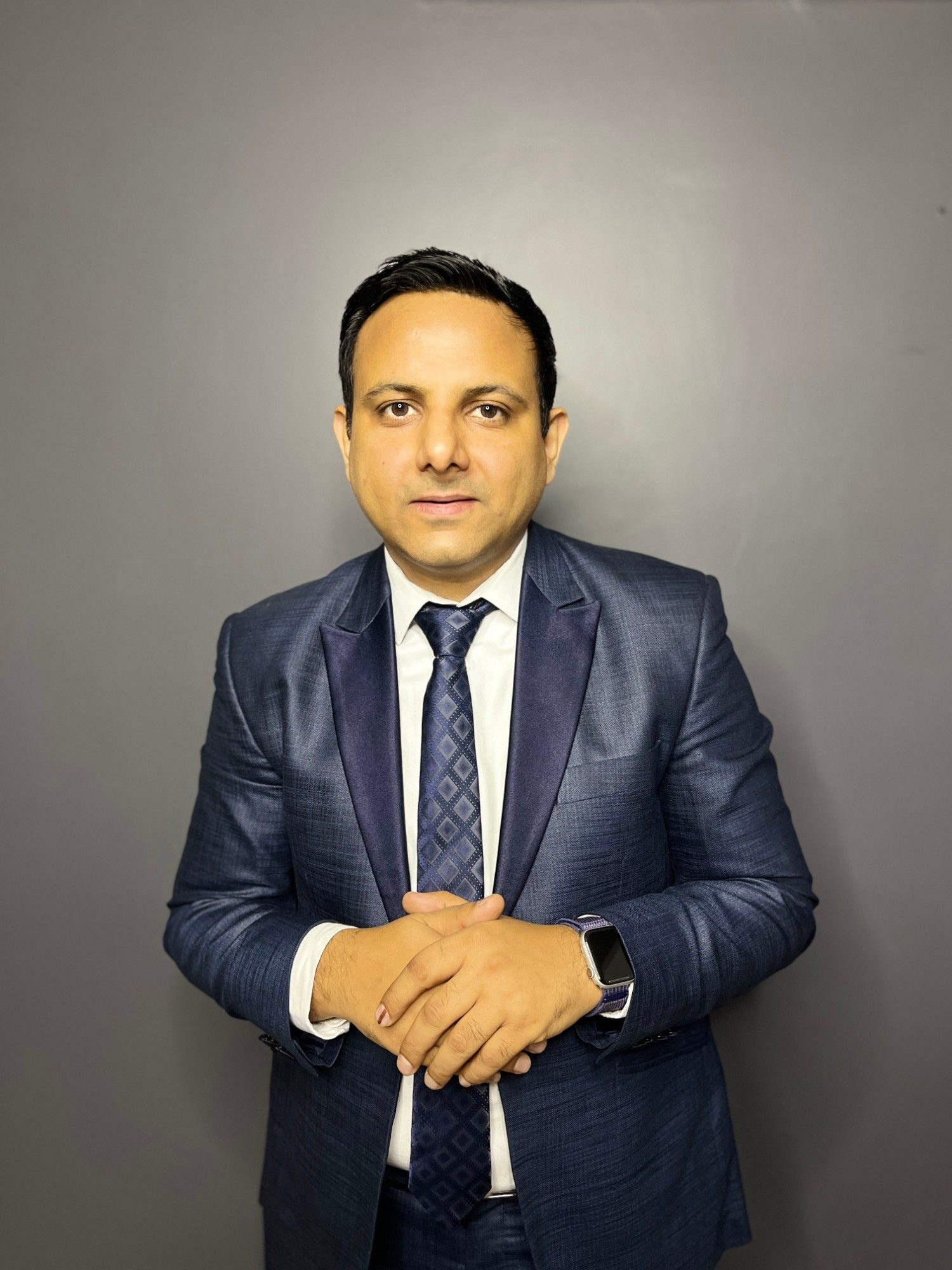Gaurav Singhal in a navy suit