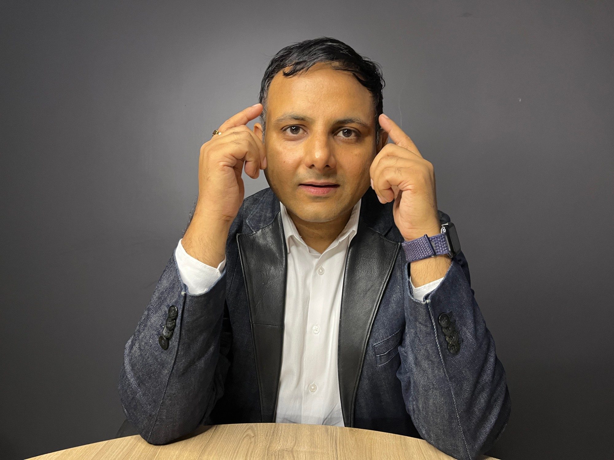 Gaurav Singhal thinking, fingers at his temples